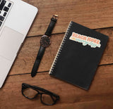 Beach More Worry Less Cute Quote Sticker on Journal with Laptop and Watch on Wood Desk in Office