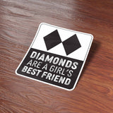 Black Diamonds are a Girl's Best Friend Ski Sticker on Wood Desk in Office