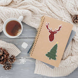 Christmas Tree Sticker and Deer Antler Decal on Notebook with Mug and Winter Sweater