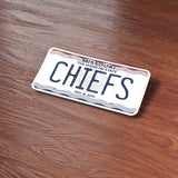 Chiefs Missouri License Plate Sticker on Wood Desk in Office