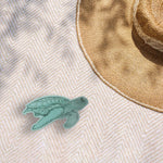 Cute Turtle Bumper Sticker Outdoors on Beach Blanket