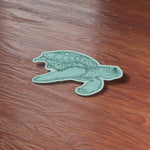 Cute Turtle Beach Sticker on Wood Desk in Office