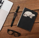 Cute Desert Wildlife Sticker on Journal with Laptop and Watch on Wood Desk in Office