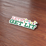 Let's Get Lit Christmas Sticker on Wood Desk