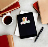 Oh Snap Gingerbread Man Christmas Sticker on Kindle eReader with Books and Coffee Mug