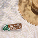 Ride More Drive Less ADV Motorcycle Sticker Outdoors on Beach Blanket