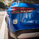Vintage Road Sign Route 66 Bumper Sticker on Car