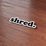 Shred Sticker on Wood Desk