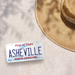 Asheville NC Sticker Outdoors on Beach Blanket