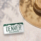Denver Bumper Sticker Outdoors on Beach Blanket