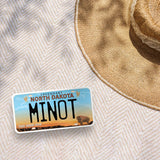 Minot North Dakota Bumper Sticker Outdoors on Beach Blanket