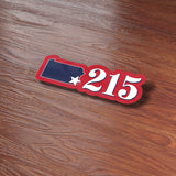 215 Philadelphia Area Code Sticker on wood background