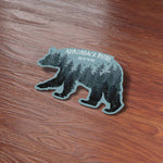 Cute Black Bear Adirondack Mountains Upstate New York Bumper Sticker on Wood Desk in Office