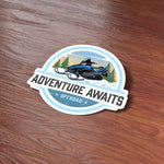 Adventure Awaits Snowmobile Sticker on wood background