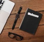 Pink Heart Arkansas Sticker on Journal with Laptop and Watch on Wood Desk in Office