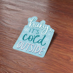 Baby It's Cold Outside Christmas Sticker on Wood Desk