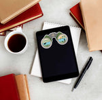 Binoculars Migratory Bird Sticker on Kindle eReader Tablet with Coffee Mug and Books