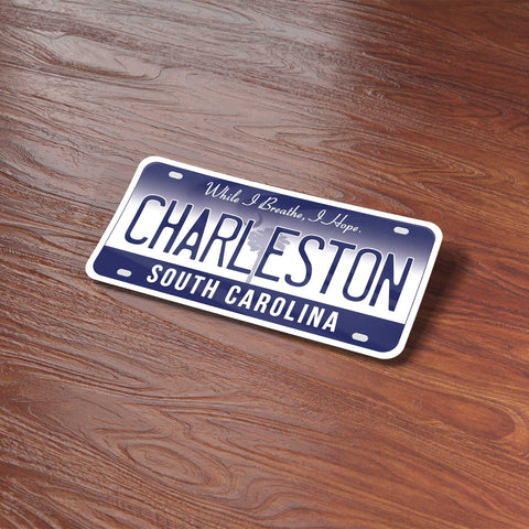 Charleston South Carolina License Plate Sticker on Wood Desk