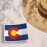 Cute Colorado Bumper Sticker Outdoors on Beach Blanket