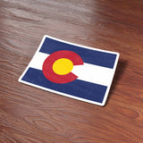 Colorado Sticker on Wood Desk in Office