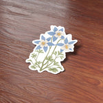 Cute Columbine Flower Colorado Sticker on Wood Desk in Office