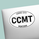 Cooke City Montana White Oval Bumper Sticker on Laptop