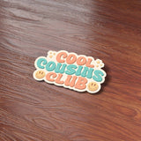 Retro Cool Cousins Club Sticker on Wood Desk in Office