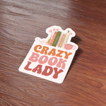 Crazy Book Lady Funny Bookish Sticker on Wood Desk in Office