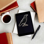 Cute Spooky Crow Birdwatching Sticker on Kindle eReader Tablet with Coffee Mug and Books
