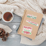 Set of Christmas Stickers on Journal next to mug of tea and sweater