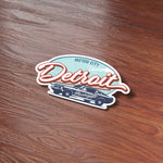 Cool Detroit Sticker on Wood Desk in Office