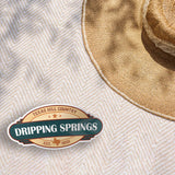 Dripping Springs Texas Hill Country Sticker on Beach Blanket Outdoors