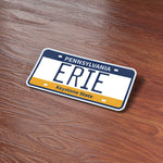 Erie Pennsylvania License Plate Sticker on Wood Desk