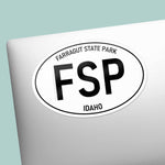 Farragut State Park Idaho White Oval Bumper Sticker on Laptop