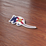 Florida Armadillo Bumper Sticker on Wood Desk