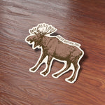 Cute Montana Bumper Sticker on Wood Desk in Office