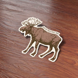 Cute Montana Bumper Sticker on Wood Desk in Office