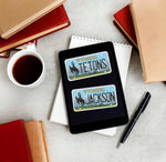 Grand Teton National Park Jackson Wyoming License Plate Sticker on Kindle eReader with Books and Coffee Mug