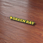 Cute Green Bay Sticker on Wood Desk in Office