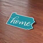 Cute Home Pennsylvania Bumper Sticker on Wood Desk in Office