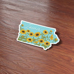 Sunflowers Iowa Sticker on Wood Desk in Office