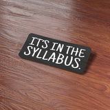 It's In the Syllabus Funny College Sticker on Wood Desk in Office