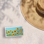 Cute Midwest Floral Bumper Sticker Outdoors on Beach Blanket