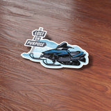 Lost on Purpose Snowmobile Sticker on wood background