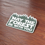 May the Forest Be With You Camping Sticker on Wood Desk in Office