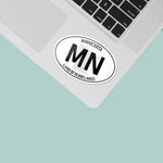 White Oval Minnesota Decal on Laptop