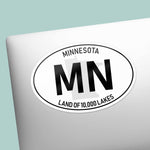 White Oval Minnesota Sticker on Laptop