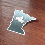 Cute Minnesota Sticker on Wood Desk in Office