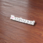 Missouri Heart Bumper Sticker on Wood Desk