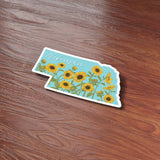 Sunflowers Nebraska Sticker on Wood Desk in Office